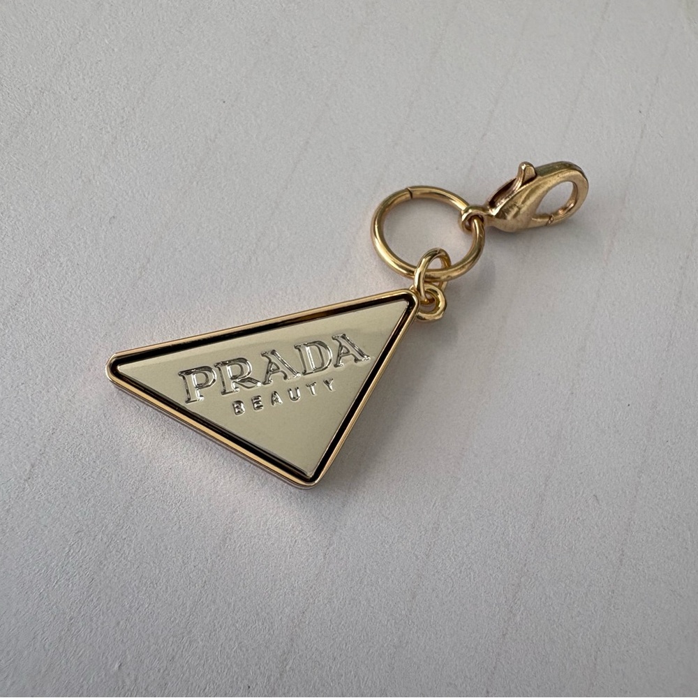 Prada Gold Triangle Logo Charm with Cream Enamel